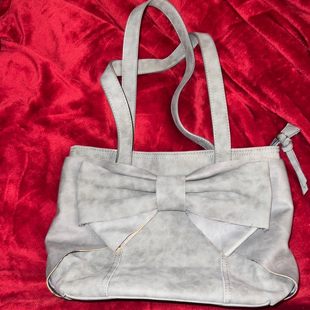 Gray bag with bow tie on front, never used